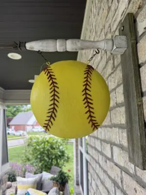 Hanging yellow softball porch decoration