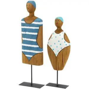 Two wooden beach figurines wearing blue swimsuits