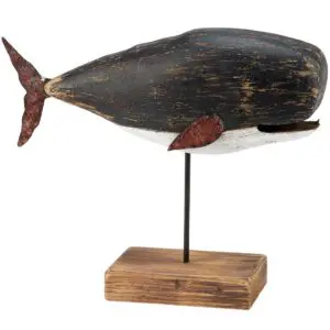 Wooden whale sculpture on a stand