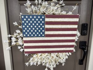 Rustic wooden American flag wreath on door