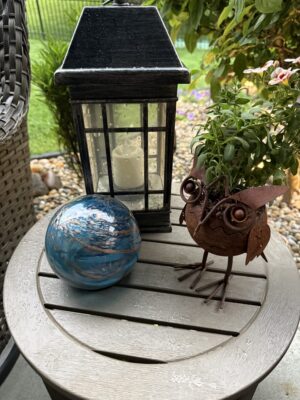 Outdoor lantern, blue orb, rusty owl planter