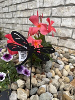 Black metal dragonfly garden stake with pink flowers