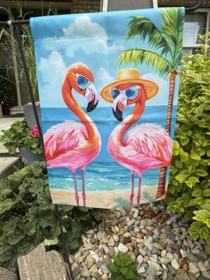 Garden flag showing two flamingos in sunglasses