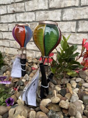 Two stained-glass hot air balloon garden stakes