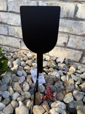 Black garden plant label stake in gravel